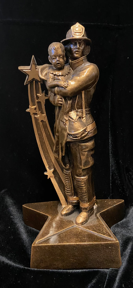 Firefighter with baby trophy